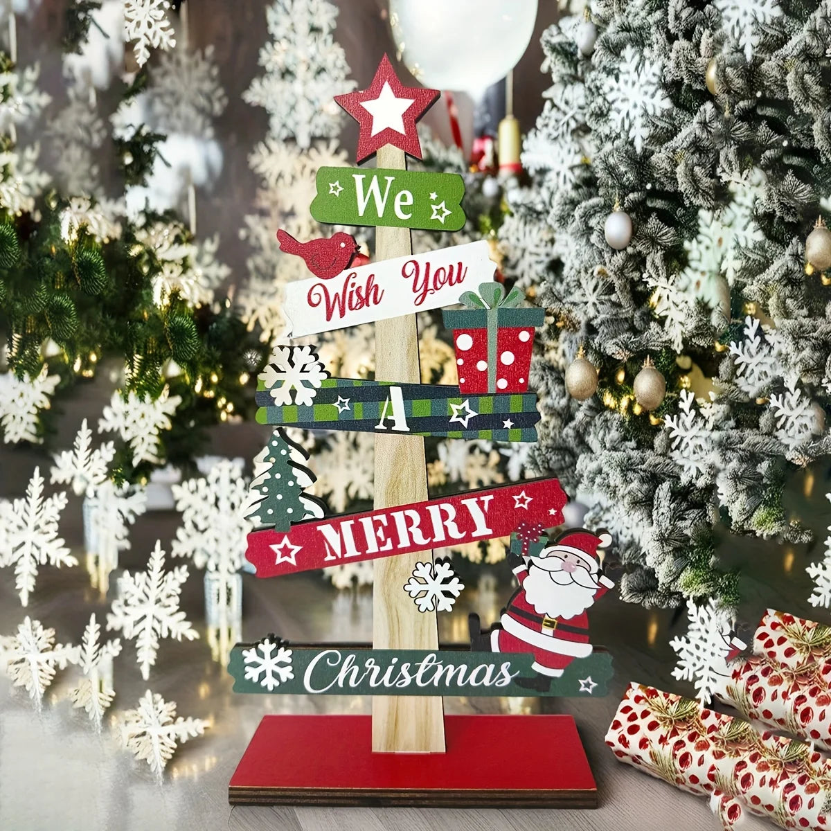 A small wooden Christmas tree with holiday decorations, Santa Claus, and gift designs, made of wood for holiday decorations